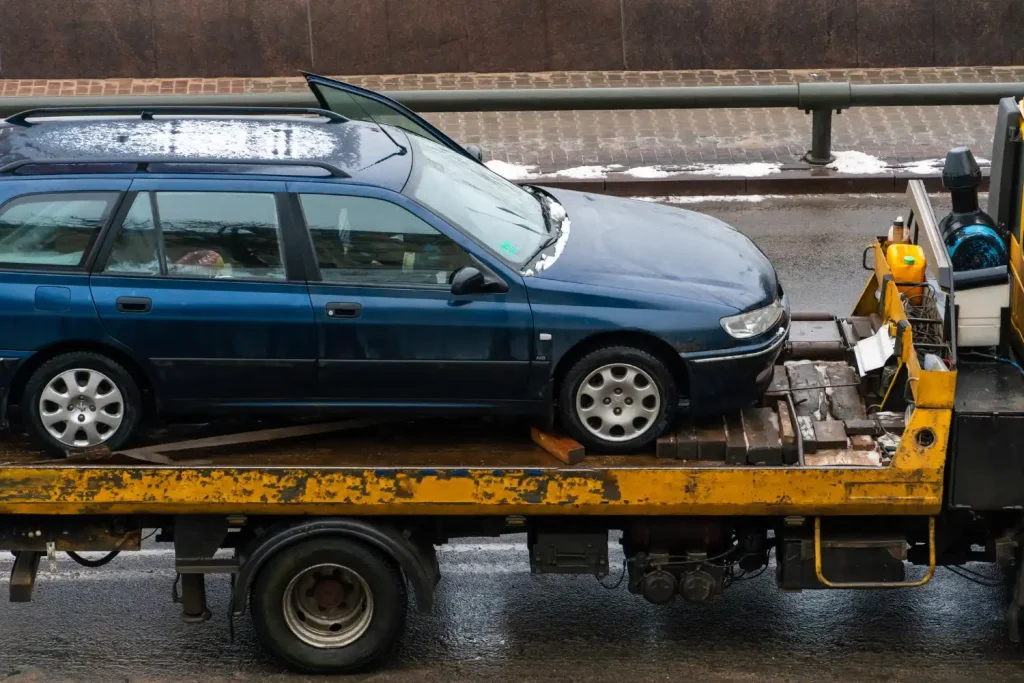 Vehicle winching and extraction service pulling cars out of mud or difficult situations